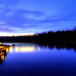 Pixel+LILIE sample for: A wide, calm lake stretches across the scene under a deep blue twilight sky with